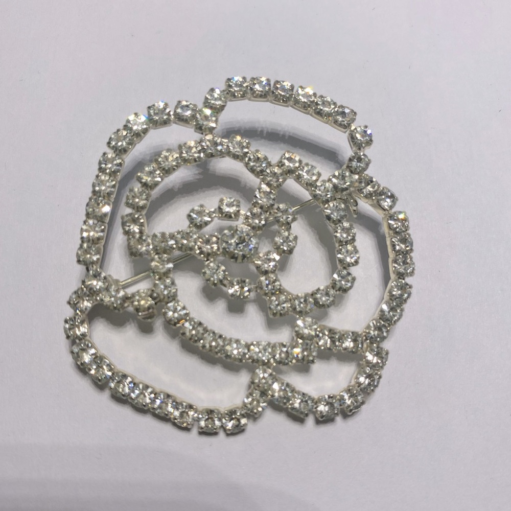 Silver and crystal flower brooch